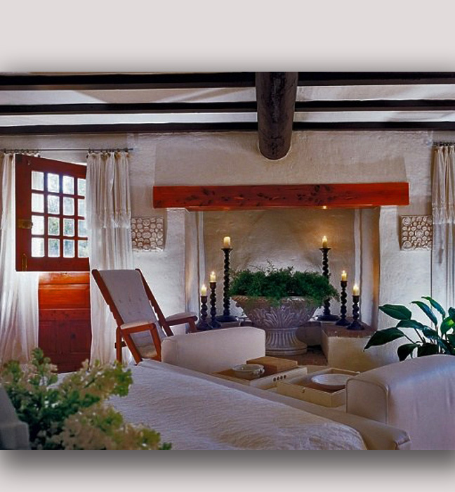 Michael Douglas/Catherine Zeta-Jones traditional Bermuda stone wall finishes as wells as finishes for historic cedar details