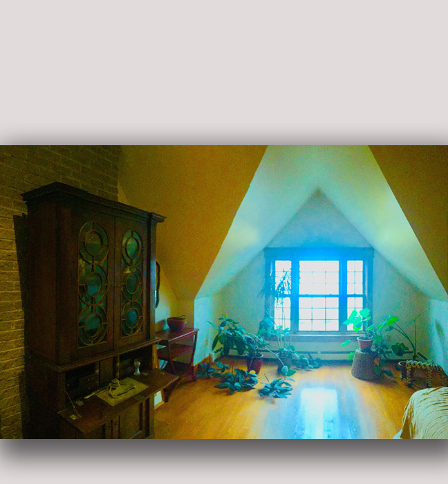 South shore, NS: We highlighted the dramatic tent-like walls in this large master bedroom with some special paint work.